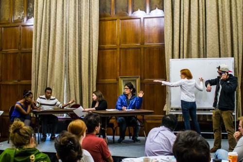 Conflict in Class UMichigan CRLT Universityof Michigan CRLT players perform a sketch on a stage in a classroom.