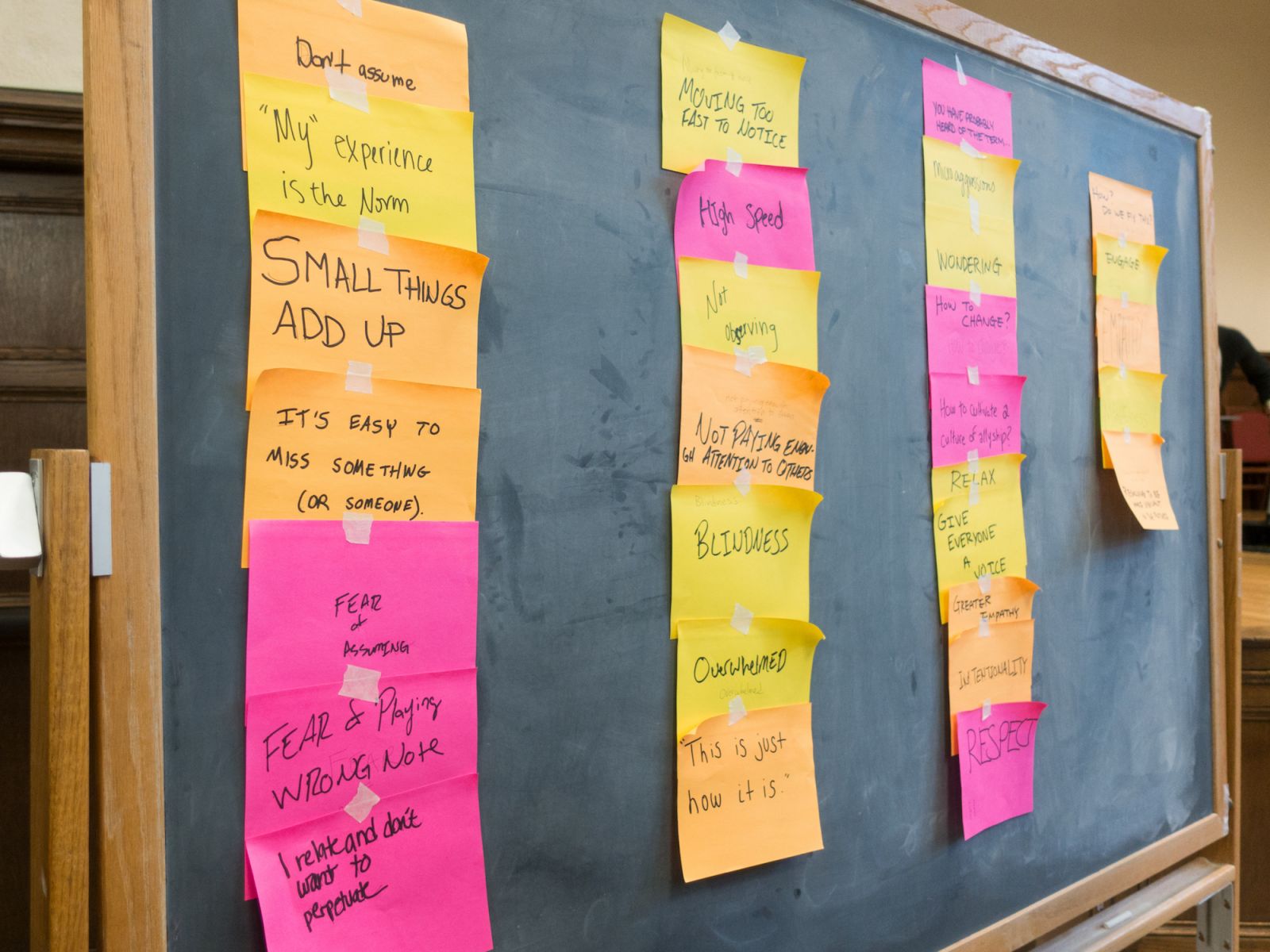 Crowd-sourced poems appear on sticky notes after the theatre performance ended